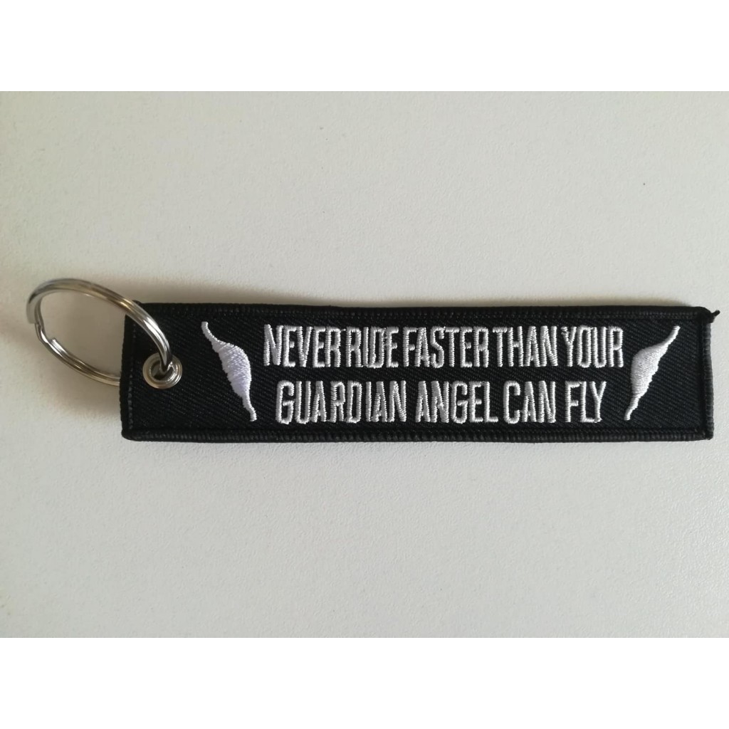 Portachiavi tessuto "Never ride faster than your guardian angel can fly"
